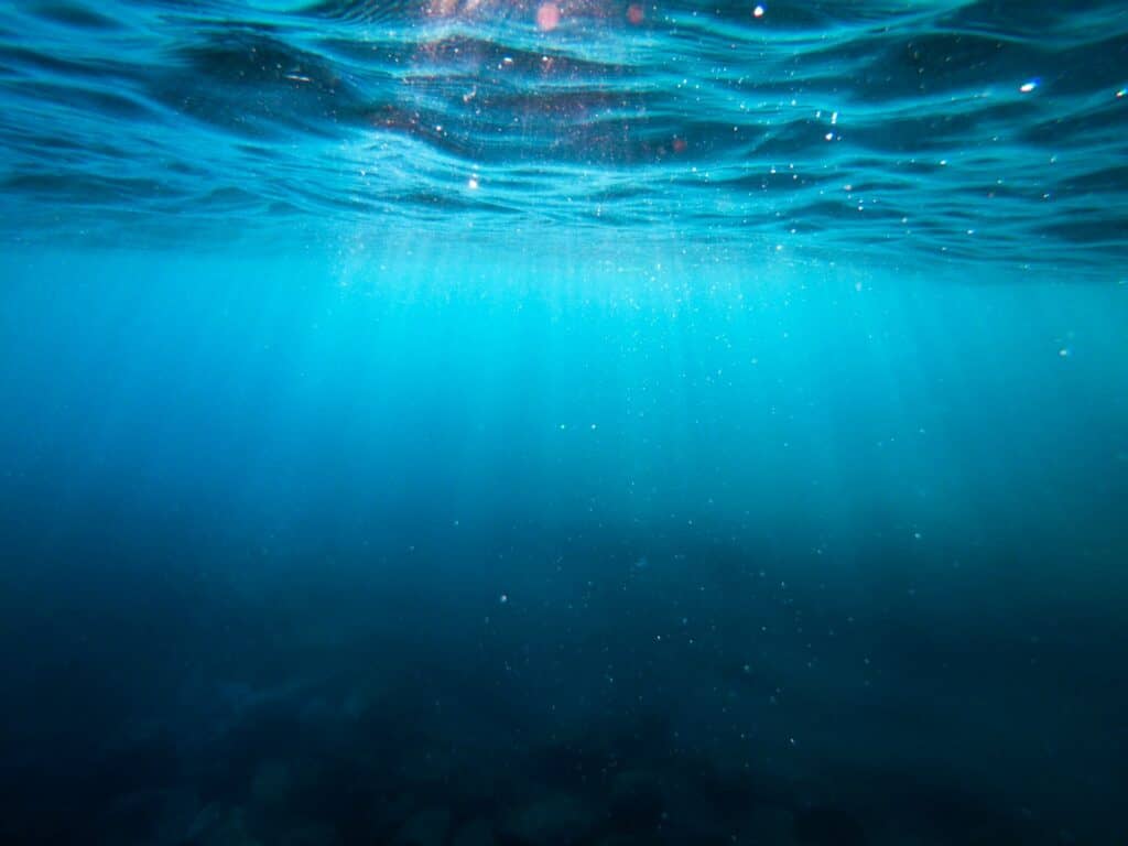 Light shining into deep ocean is symbolic of working with intuitive dreams and astrology