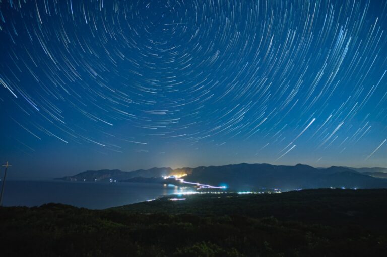 Circles of light in night sky indicates astrology and dream work.