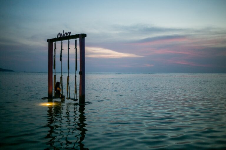Swinging on top of the ocean