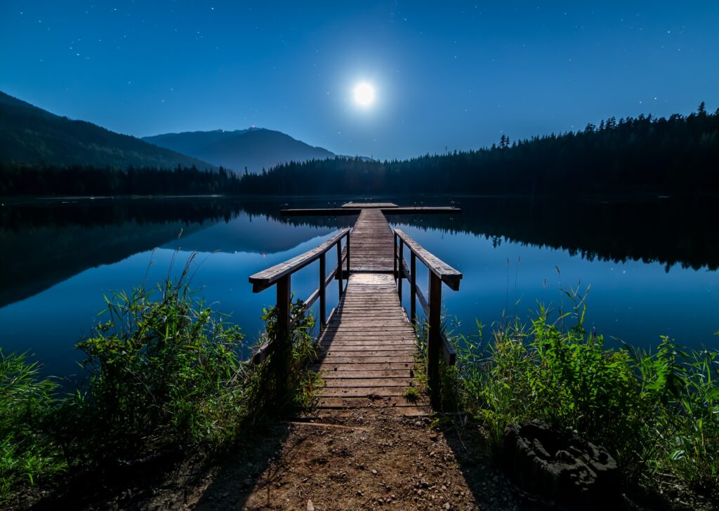 Full moon over a pier