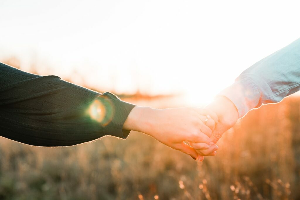 A couple holding hands in the light represents astrologer Deborah Lee's work with relationship issues.