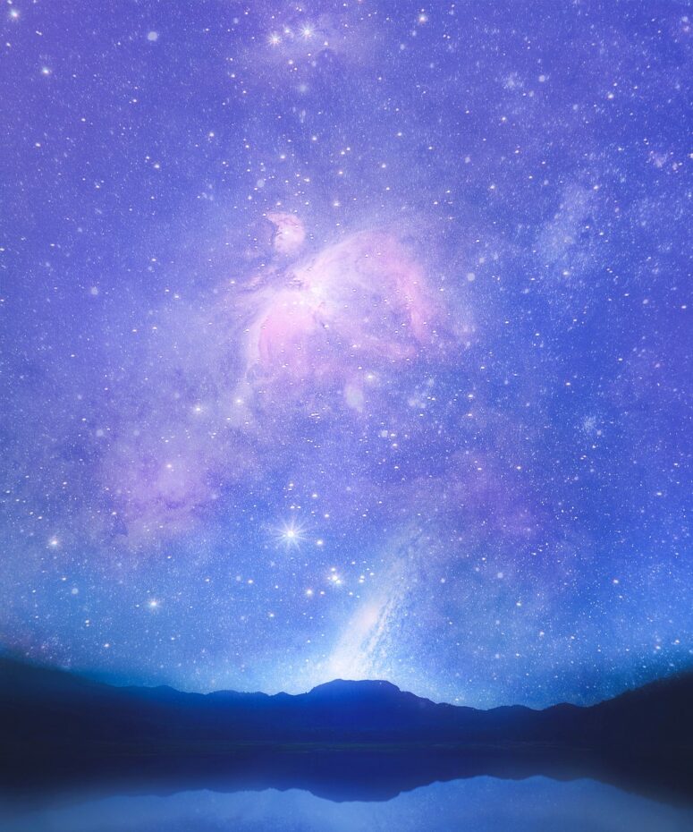 Star-lit sky over lake
