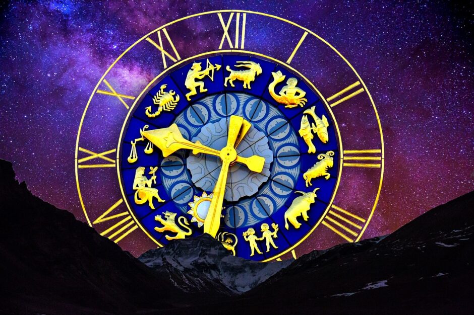Astrology clock over moutain and sky